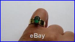 Gold hammered wide band ring with green stone James Avery